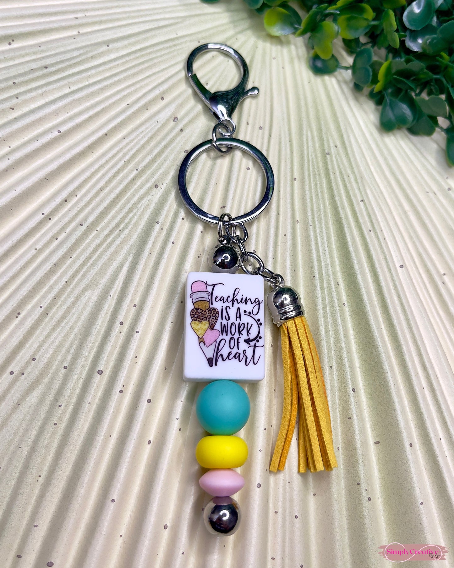 Teaching is a work of heart metal bar keychain